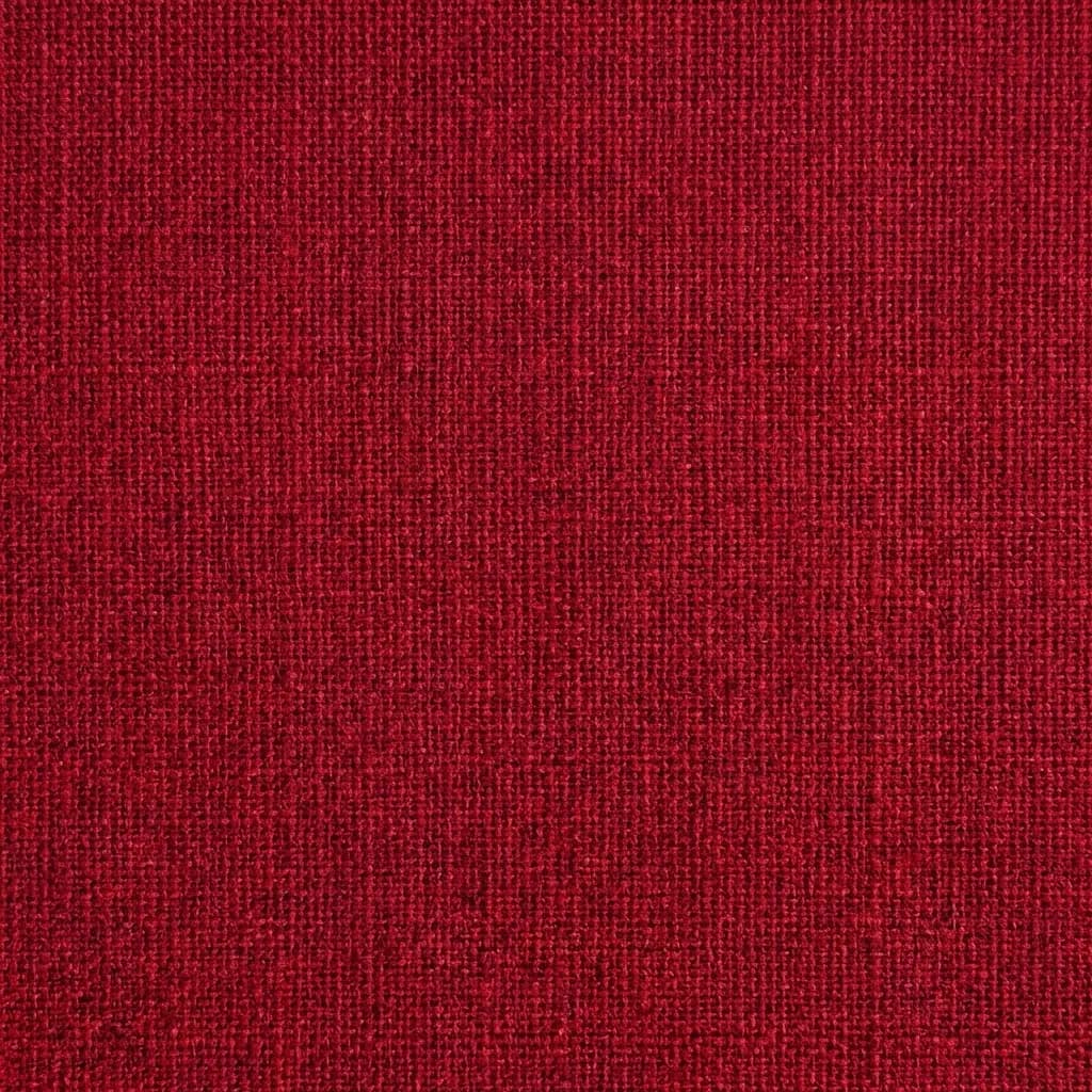 深い赤色の生地をクローズアップした画像で、その緻密でざらつきのある質感がはっきりと見て取れる。しっかりと織られた丈夫な布地と思われ、鮮やかな深紅色の中には微妙な濃淡の差や黒っぽい斑点が織り込まれており、表面に奥行きと触感を添えている。